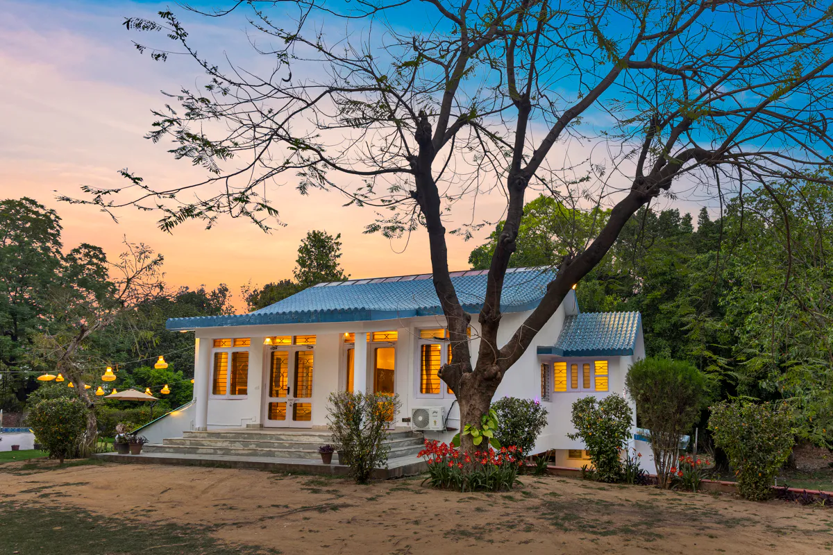 Crystal Farms — Farmhouse Exterior at Dusk