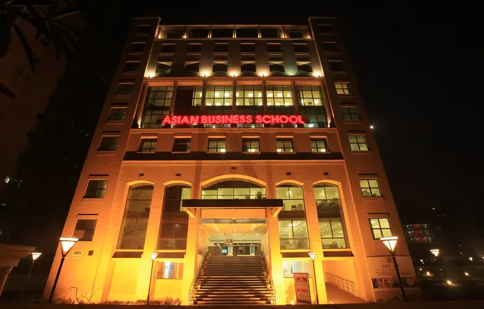 A campus building lit at night, Noida