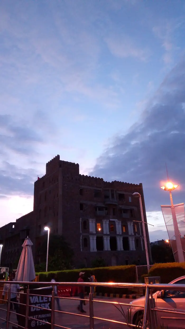 A fort-style building at dusk, Saket